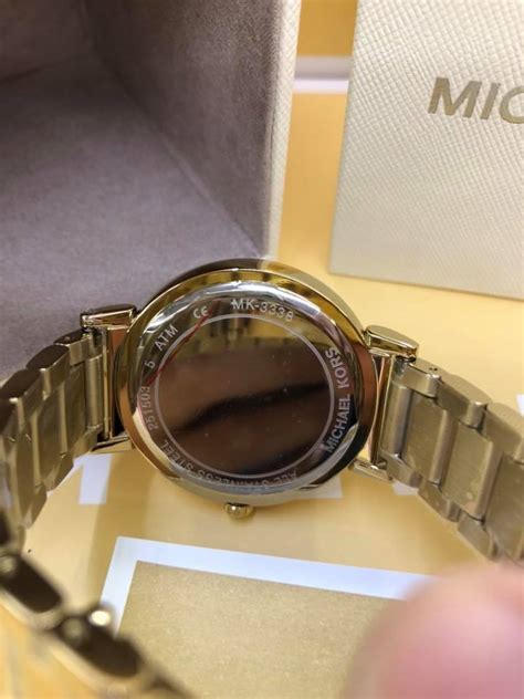 check michael kors watch serial number